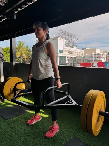 Using a trap bar for deadlifts can be a great alternative to the straight bar, as it puts less stress on the lower back. This client is lifting heavy while maintaining a strong, upright posture.