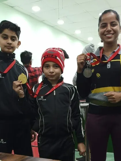 Our students, both young and experienced, showing off their medals after a successful competition. We foster an environment where shooters of all ages can learn from each other.