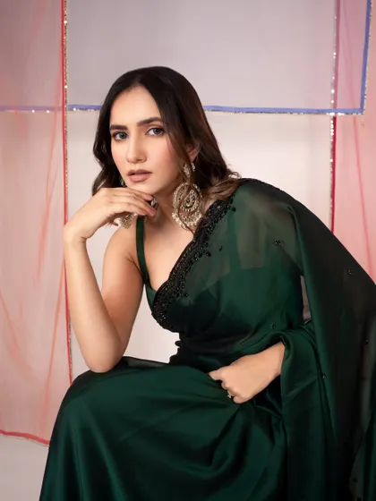 An elegant and modern saree look for an e-commerce brand. The clean background and direct pose keep the focus on the product.