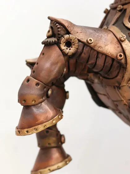 A close-up of the front leg, demonstrating the detailed armor plating and gear accents.