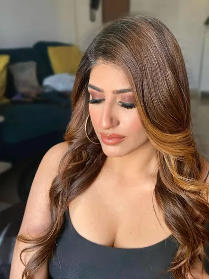 A dewy and fresh look for influencer 'The Filmy Kudi'. The focus is on luminous, sun-kissed skin and a warm, shimmering eye.
