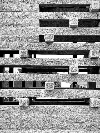 A black and white detail of the granite jaali at the Tiruppur house. The removal of color emphasizes the texture, form, and the beautiful interplay of solid and void.