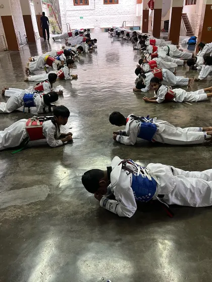 "We only start counting when it starts hurting." My students hold a plank, a core conditioning exercise that builds immense physical and mental strength, inspired by the words of Muhammad Ali.