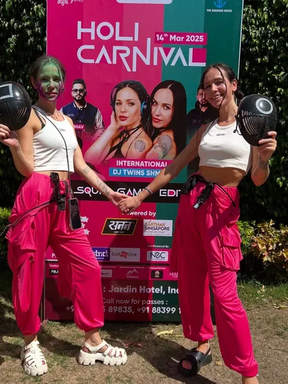 Posing in front of our poster for the Holi Carnival. It's always a proud moment to see our name on the lineup for such a big event.