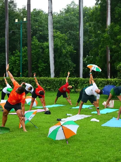 Practicing a standing side bend, a great yoga pose for stretching the obliques and improving spinal flexibility.