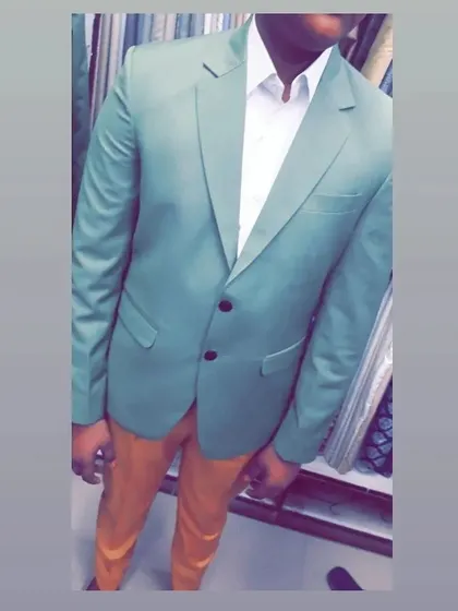 This client opted for a light green blazer paired with contrasting trousers. This shows how a custom blazer can add a pop of color to your wardrobe.