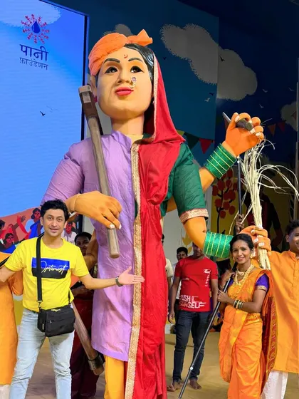 Another angle of the Bali Raja puppet with the performers. The vibrant colors and sheer size made it a centerpiece of the event.