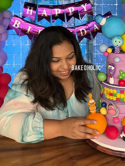 Here I am with my 'Inside Out' themed birthday cake. This cake was truly from the heart, celebrating all our emotions, the good and the bad.