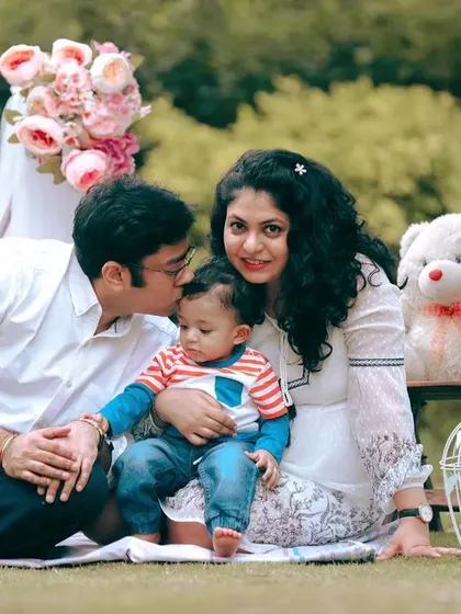 A lovely family picnic setup for a one year old's photoshoot, complete with simple props for a sweet, styled scene.