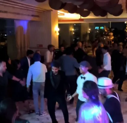 A group of colleagues dancing together at their corporate event. It's all about creating a fun and inclusive atmosphere for everyone.