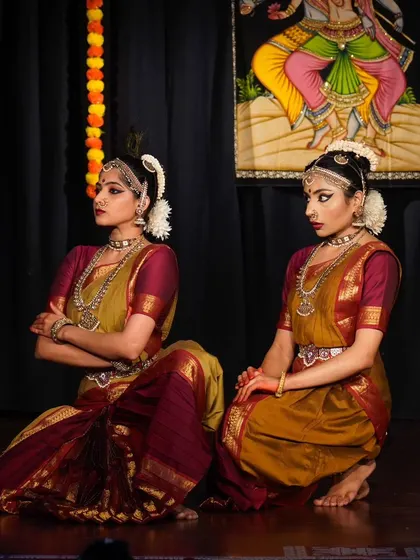 A pose showing the standoff between Radha and Krishna. The use of stage space and the distance between dancers is a key part of the duet's choreography.