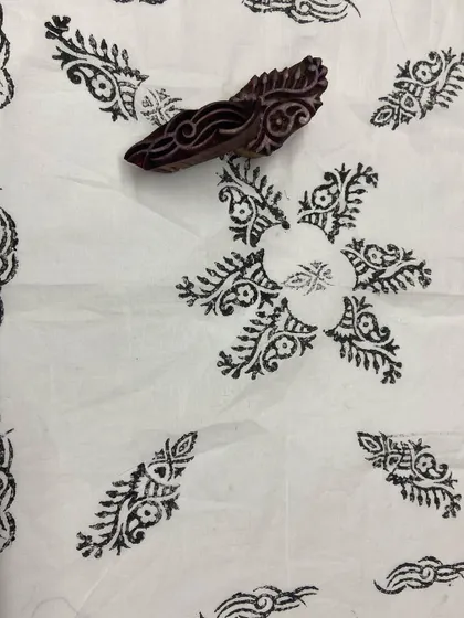 A sample of a scattered floral block print pattern.