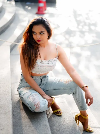 A duplicate of image 481, this relaxed portrait of a model sitting on stone steps is a beautiful and effortless fashion image.