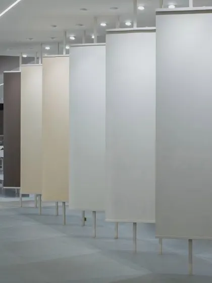 More images from the Krsimar marble showroom, detailing the sliding panel display system and the clean, spacious layout designed for an optimal client experience.