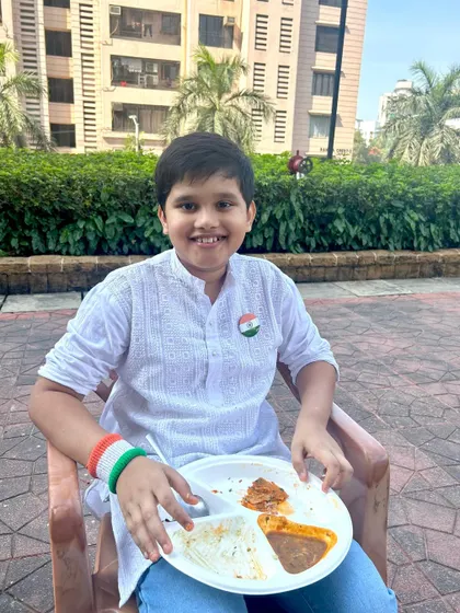 A young guest enjoying his plate at our Republic Day brunch. It's important to me that my menu has delicious options for guests of all ages.
