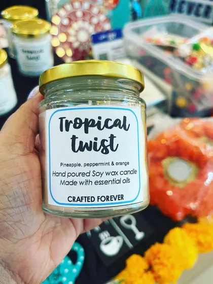 Get a "Tropical Twist" with this candle, scented with pineapple, peppermint, and orange. It's like a vacation in a jar!