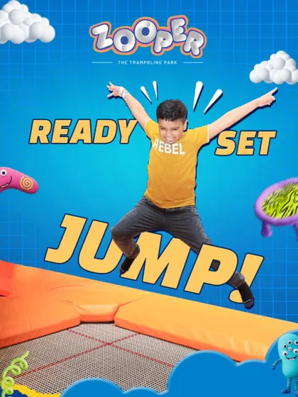 Ready, set, jump. A young rebel catches some serious air on the trampoline, ready for a day of high-flying fun.