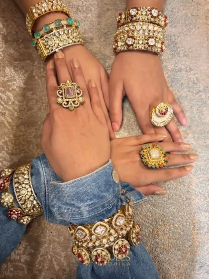 Stack it, mix it, flaunt it. This image shows multiple hands adorned with a variety of our bangles, kadas, and rings, demonstrating endless styling possibilities.