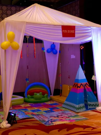 For younger guests, I set up a dedicated "Fun Zone" tent with soft play mats, a small ball pit, and a teepee, ensuring there's something for every age group.