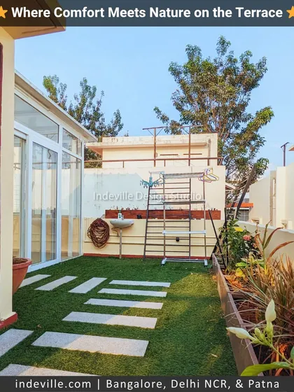 A practical and green pathway on a terrace. I used stone slabs embedded in artificial turf to create a walkway, connecting different parts of the terrace while maintaining a natural look.
