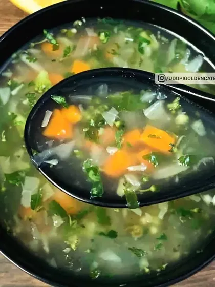 A light and refreshing Lemon Coriander Soup, filled with finely chopped vegetables. This clear soup is a healthy and zesty option to begin a meal.