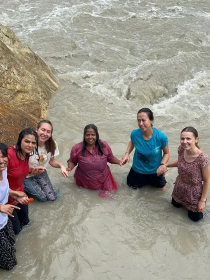 A moment of pure joy and connection, taking a dip in the river with fellow yogis. These shared experiences create bonds that last a lifetime.