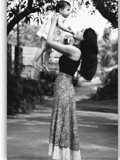 Merry Christmas from our family. This beautiful black and white photo with my daughter captures the warmth and love of the holiday season.