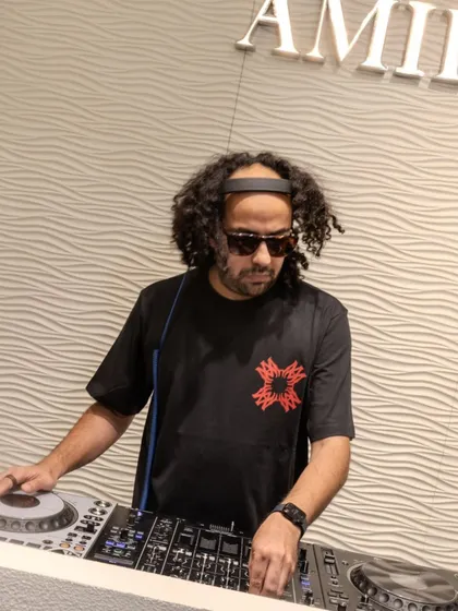 A clear shot of me at the decks during the Amiri event. This shows the professional setup and my focused approach to DJing for corporate and brand clients.