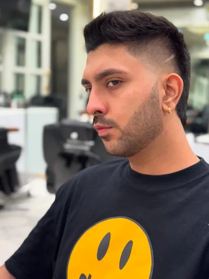 Confidence starts with the cut. This image shows a fresh fade with clean lines, a popular and stylish choice for modern men.