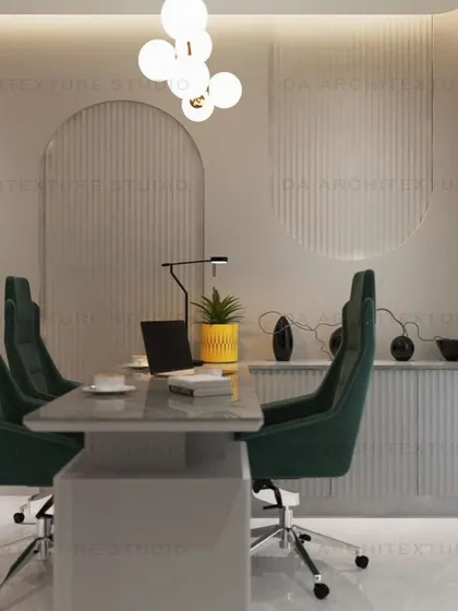 The main conference or meeting area, with comfortable green chairs and a clean, minimalist design to foster collaboration.