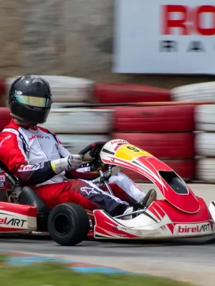 Racing past the Rotax banner, our driver in kart 97 pushes the limits. We compete at the highest level in national championships like the Rotax Max Challenge.
