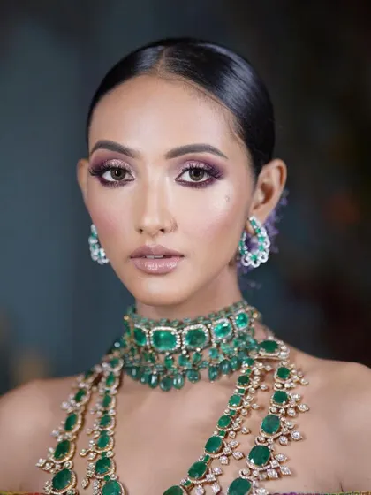 A modern bridal look with a purple smokey eye. Learn to create contemporary and trendy looks for the new-age bride.