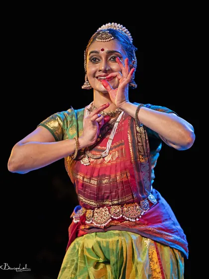 A playful and expressive moment, captured mid-gesture.