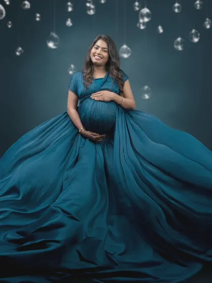 Absolutely mesmerized by this shot. The beauty of this moment is amplified by the perfect blend of art and technology, with a flowing blue gown and a dreamy backdrop.