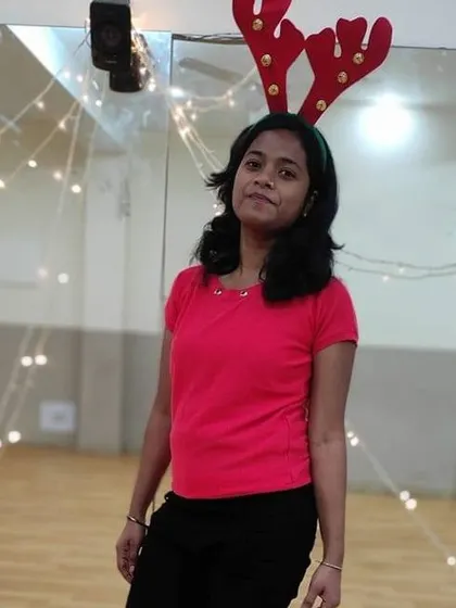 One of our members posing with reindeer antlers during our festive Christmas class.