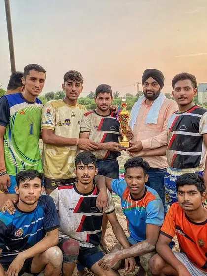 Our team celebrating their 1st position win at the Hapur 60kg kabaddi tournament on a mud court.