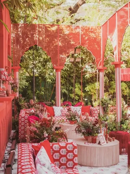 An immersive lounge experience at the "Red Affair," where the walls, seating, and decor are all unified by a rich, warm red palette, creating a passionate and energetic vibe.
