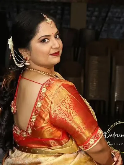 A view of the complete look for the Upanayanam ceremony, including the hairstyle. The makeup is paired with a soft, wavy ponytail, creating a look that is both traditional and stylish.