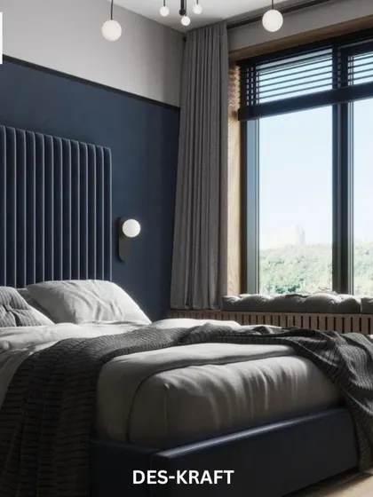 The bedroom's large window features a cozy, built-in seating nook, offering a perfect spot to relax and enjoy the view, framed by elegant grey curtains.