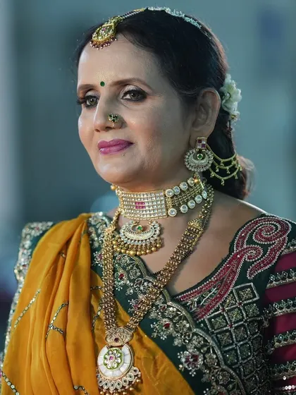 My jewellery is not just for brides. Here, the mother of the bride looks elegant in a layered Kundan set rented for the wedding festivities.