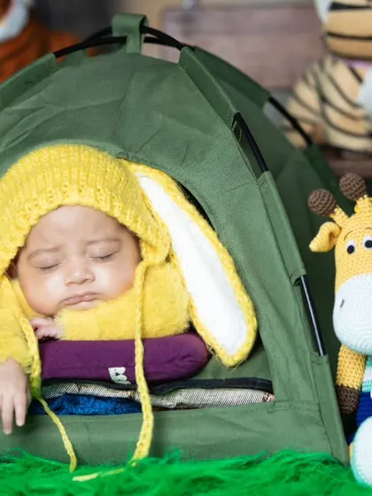 A slightly different angle of the sleeping camper, highlighting the cute giraffe plushie.