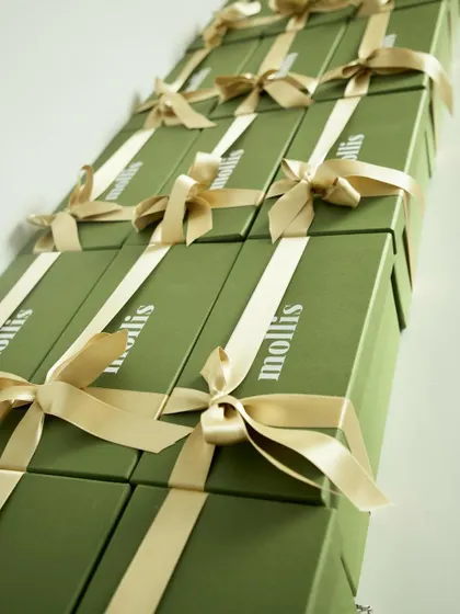 A row of the beautifully tied Rakhi gift boxes, ready for delivery.