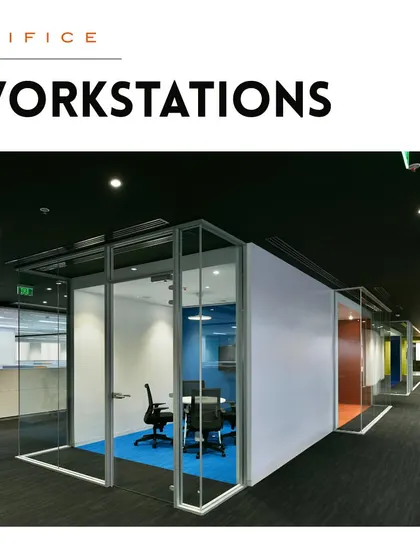 A glass-enclosed meeting room adjacent to an open corridor. This design promotes transparency and visual connection while providing a private, acoustically controlled space for formal discussions.