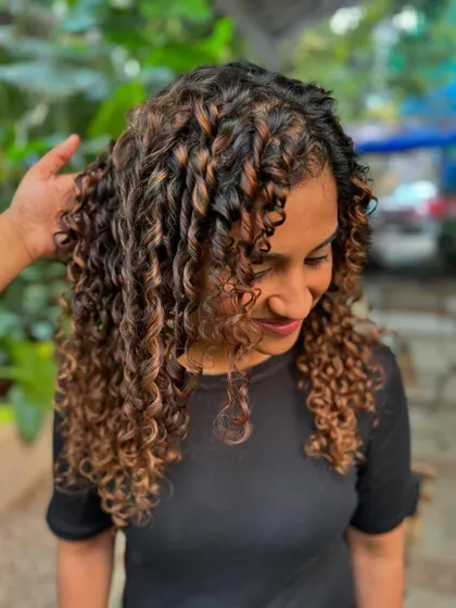 When life gives you curls, flaunt them. A fresh cut and non-bleach color to make these curls pop. (No filter)