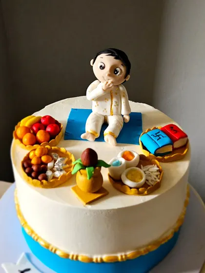 A detail shot of the baby figurine for the Annaprasan cake, capturing a sweet, innocent expression.
