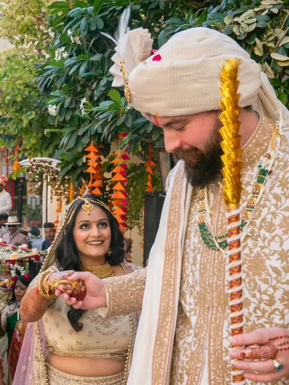 A candid moment between the bride and groom during their wedding rituals.