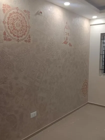 For a peaceful and spiritual ambiance, I combine different motifs like the Buddha and mandalas. This wall features subtle, tone on tone stenciling to create a serene and textured backdrop in a meditation or bedroom space.