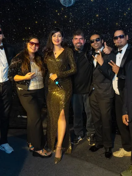 Posing with a guest at a New Year's Eve event. We love interacting with the audience and making them feel like part of the show.