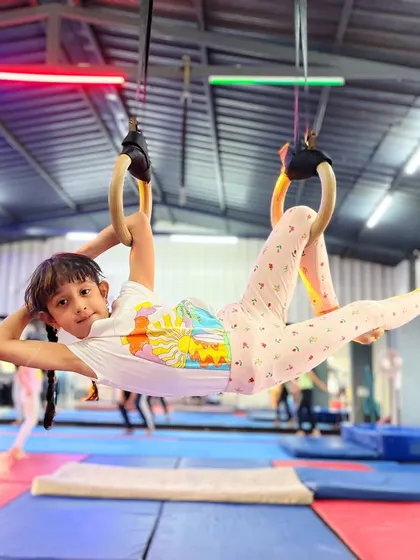 It all starts with a smile. We make fitness fun for our youngest athletes, helping them build confidence and coordination on the gymnastic rings while discovering a love for movement.