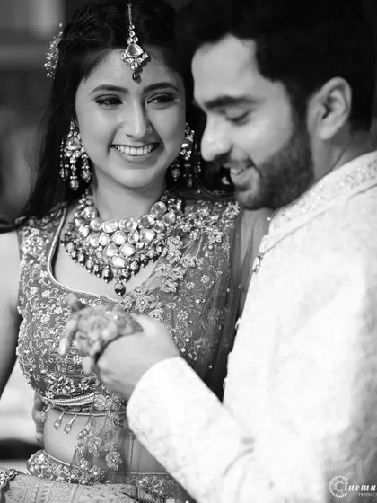 A beautiful black and white candid of a couple sharing a quiet, happy moment during their engagement festivities.